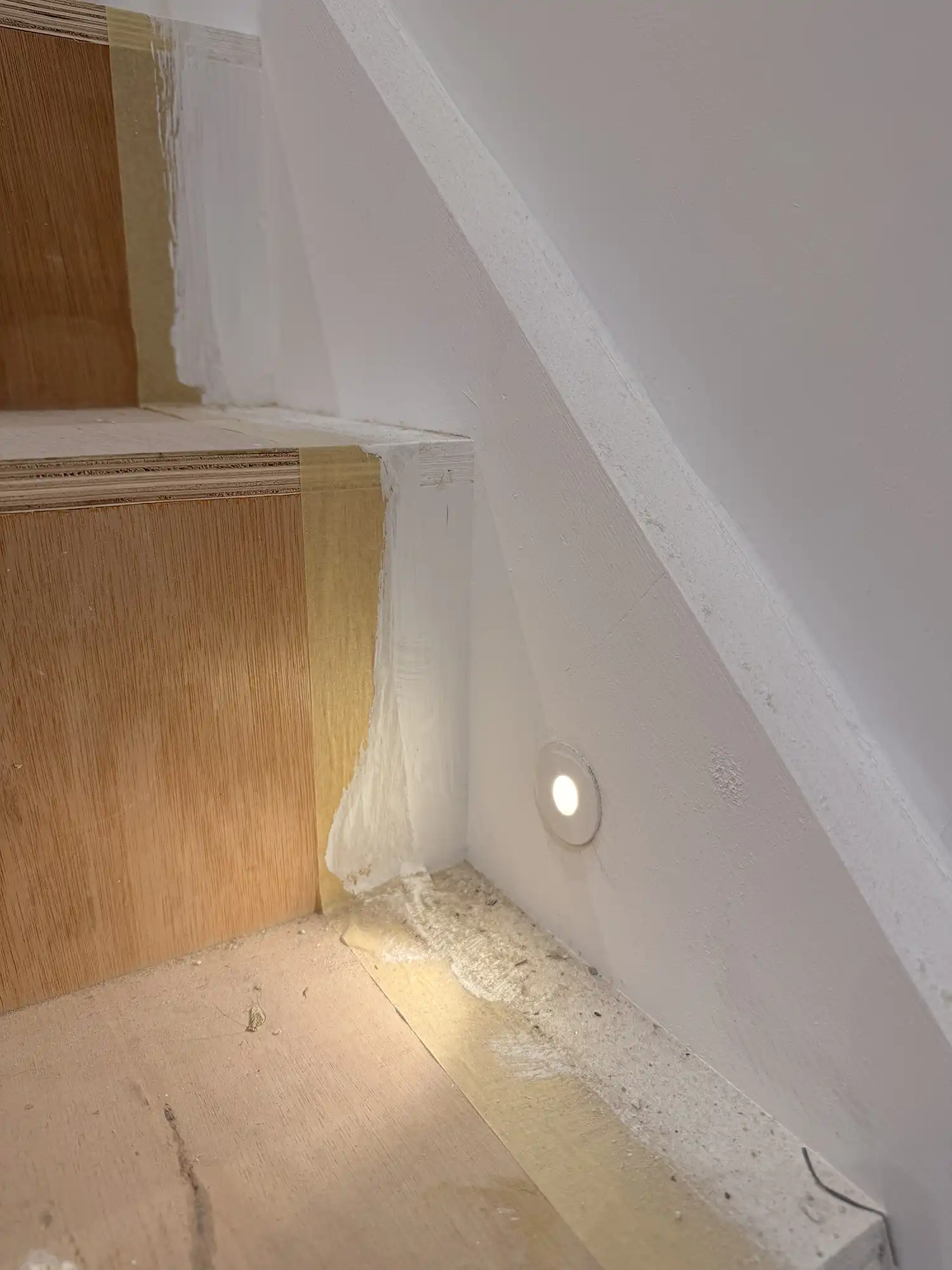 A light that is on in the corner of a room.