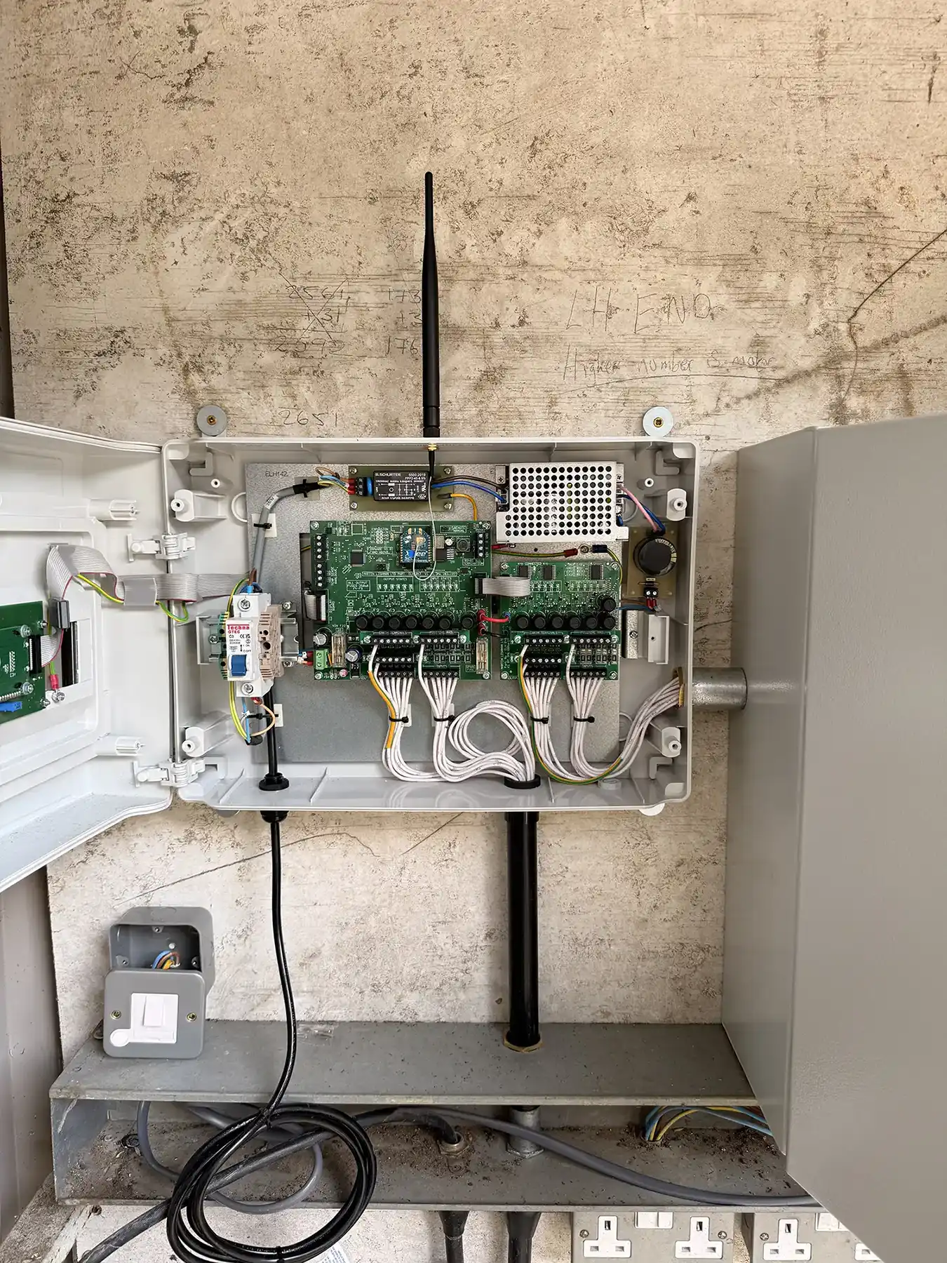 An electrical panel with wires attached to it.