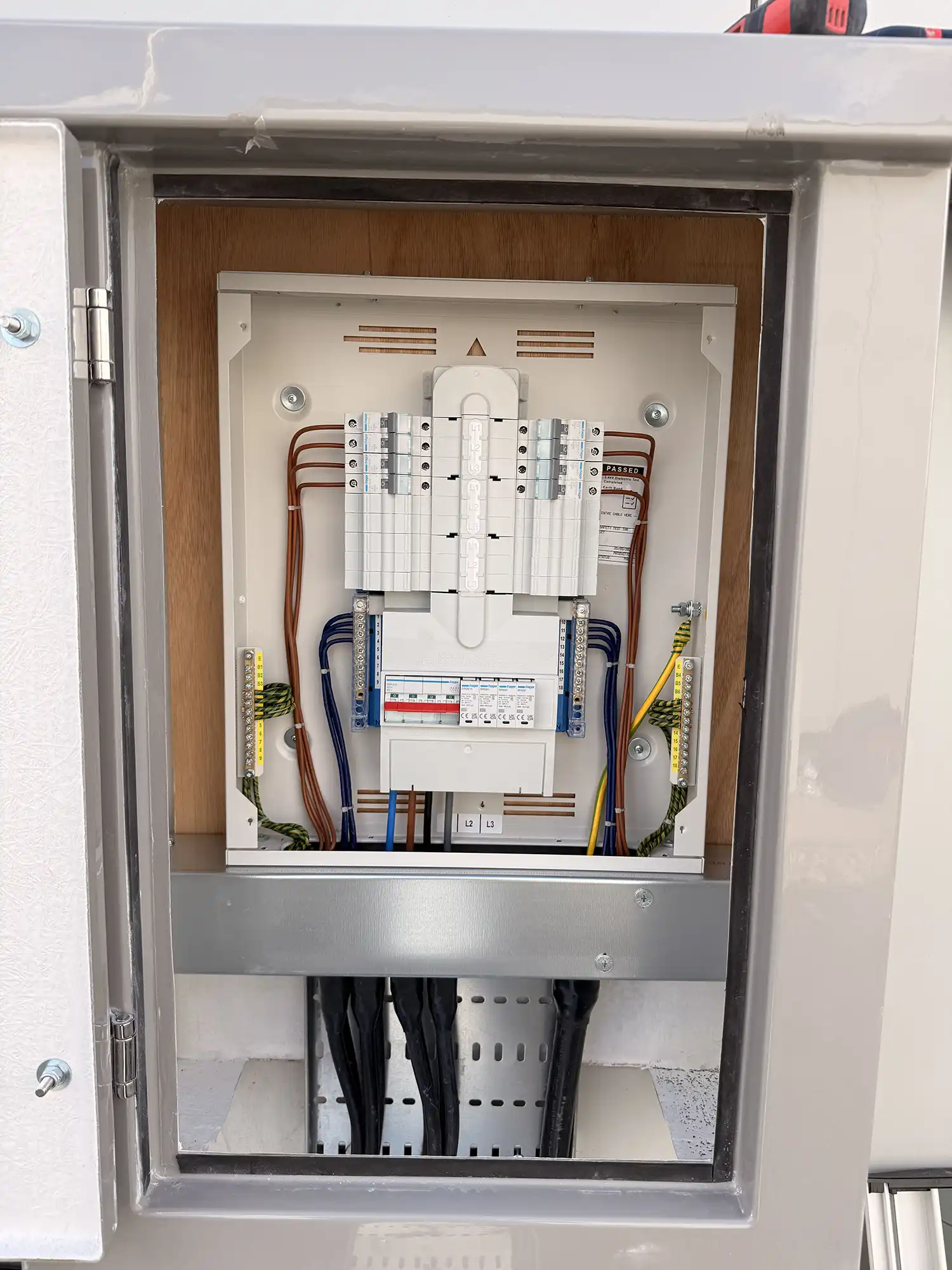 An electrical panel with multiple wires in it.