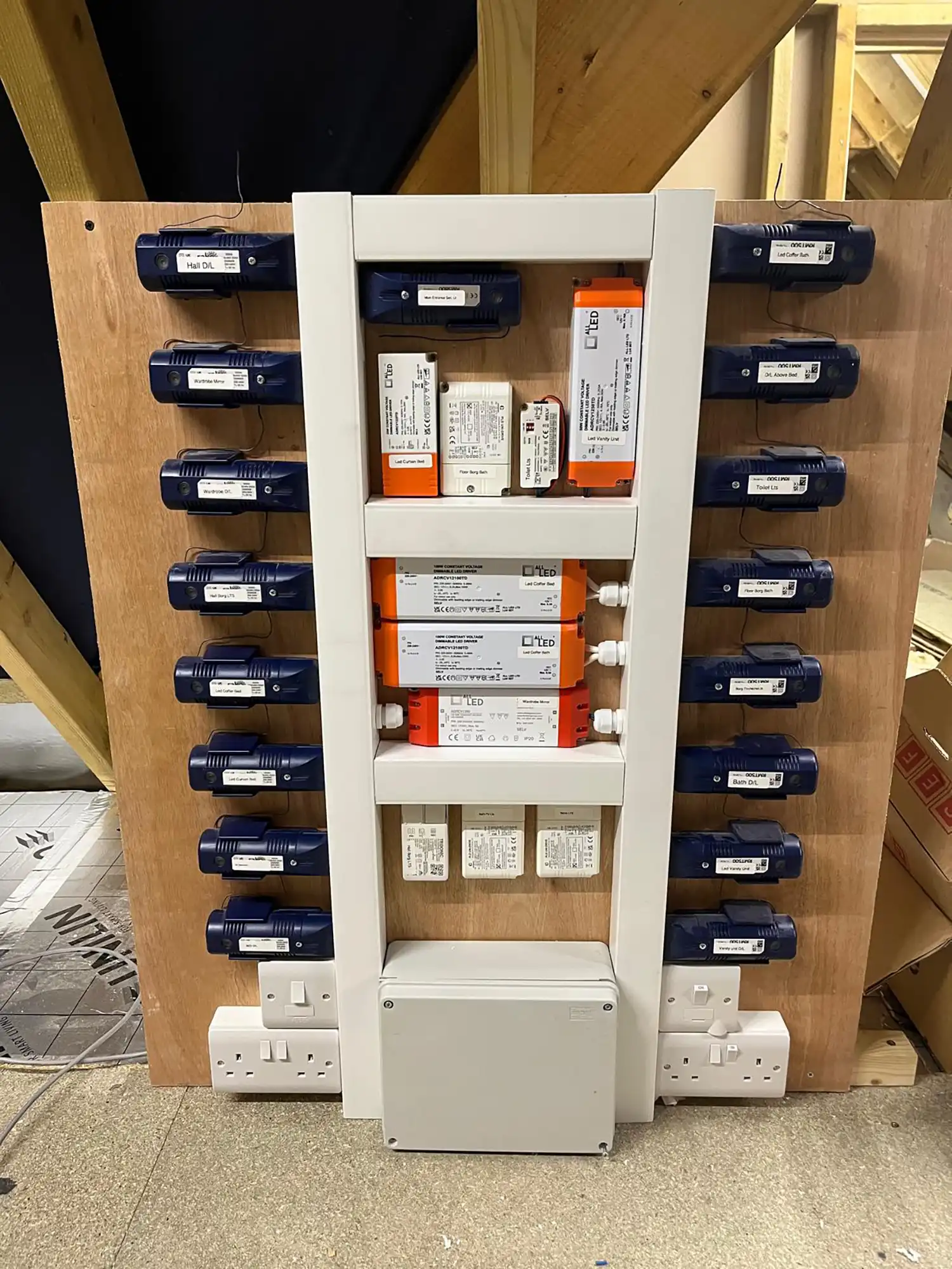 A shelf with several different types of electrical devices on it.