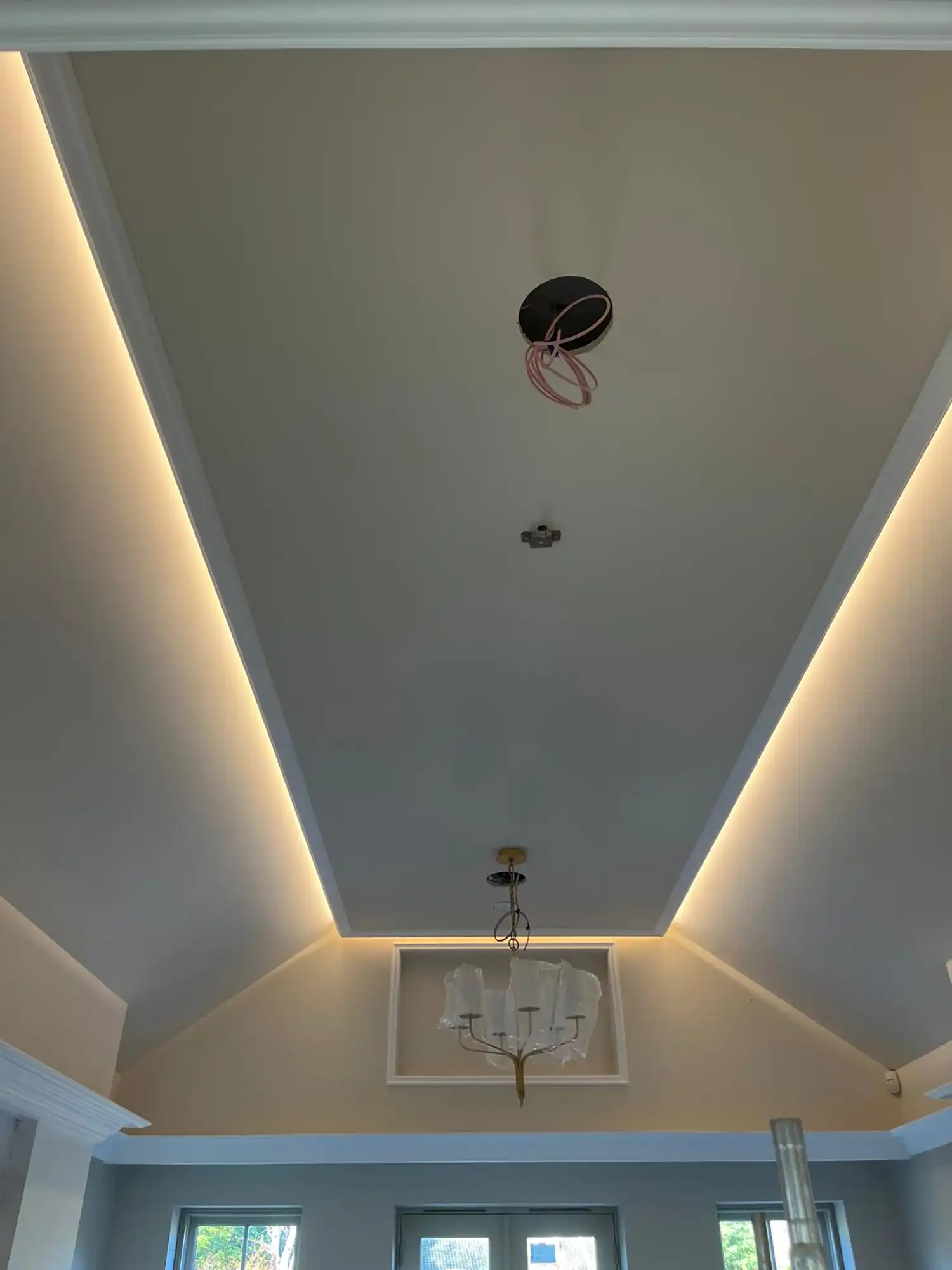A living room with a chandelier and a chandelier.