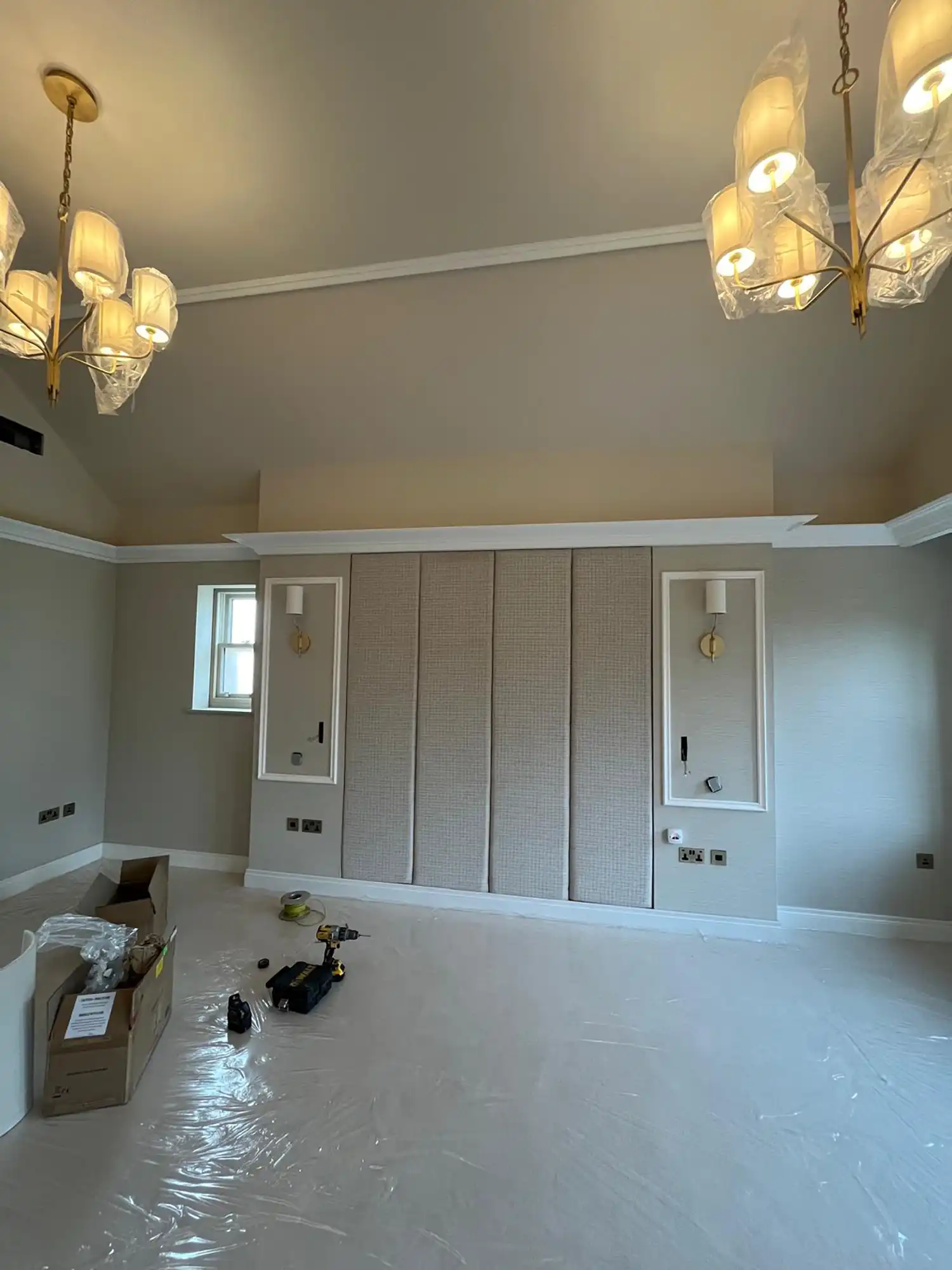 A room with a lot of white paint on the walls.